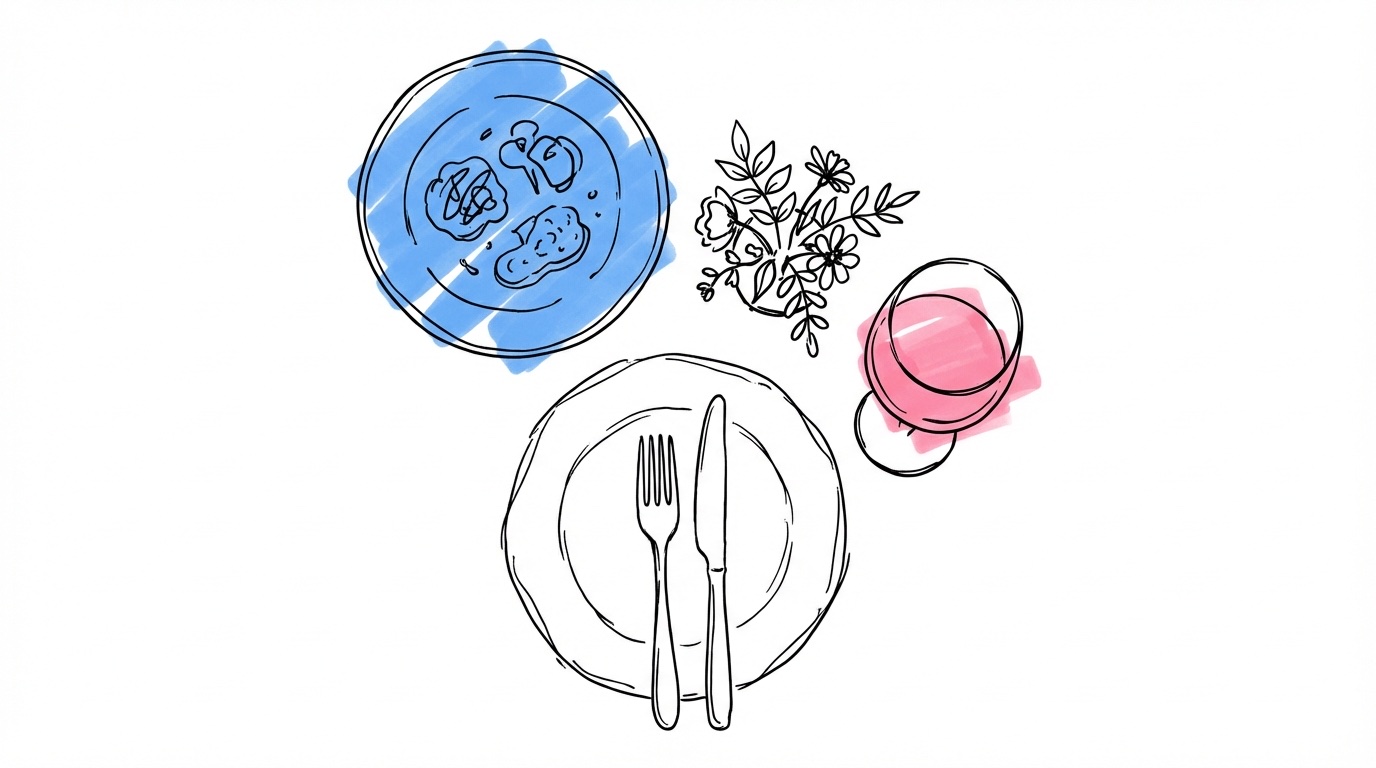 Elegant kuvert med avsmakningmeny, fint vinglas och liten blomsterarrangemang — kvalitet framför kvantitet