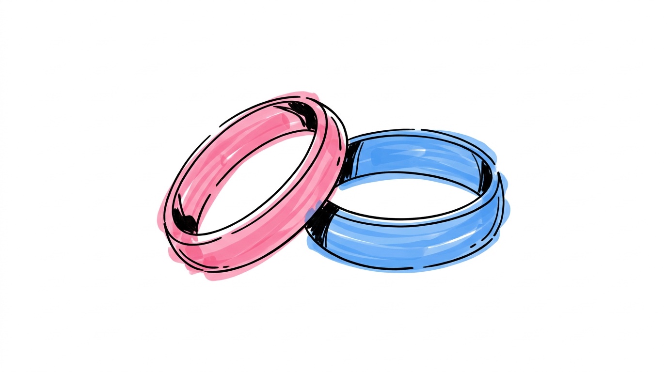 Två vigselringar sida vid sida — en rosa och en blå — mot vit bakgrund